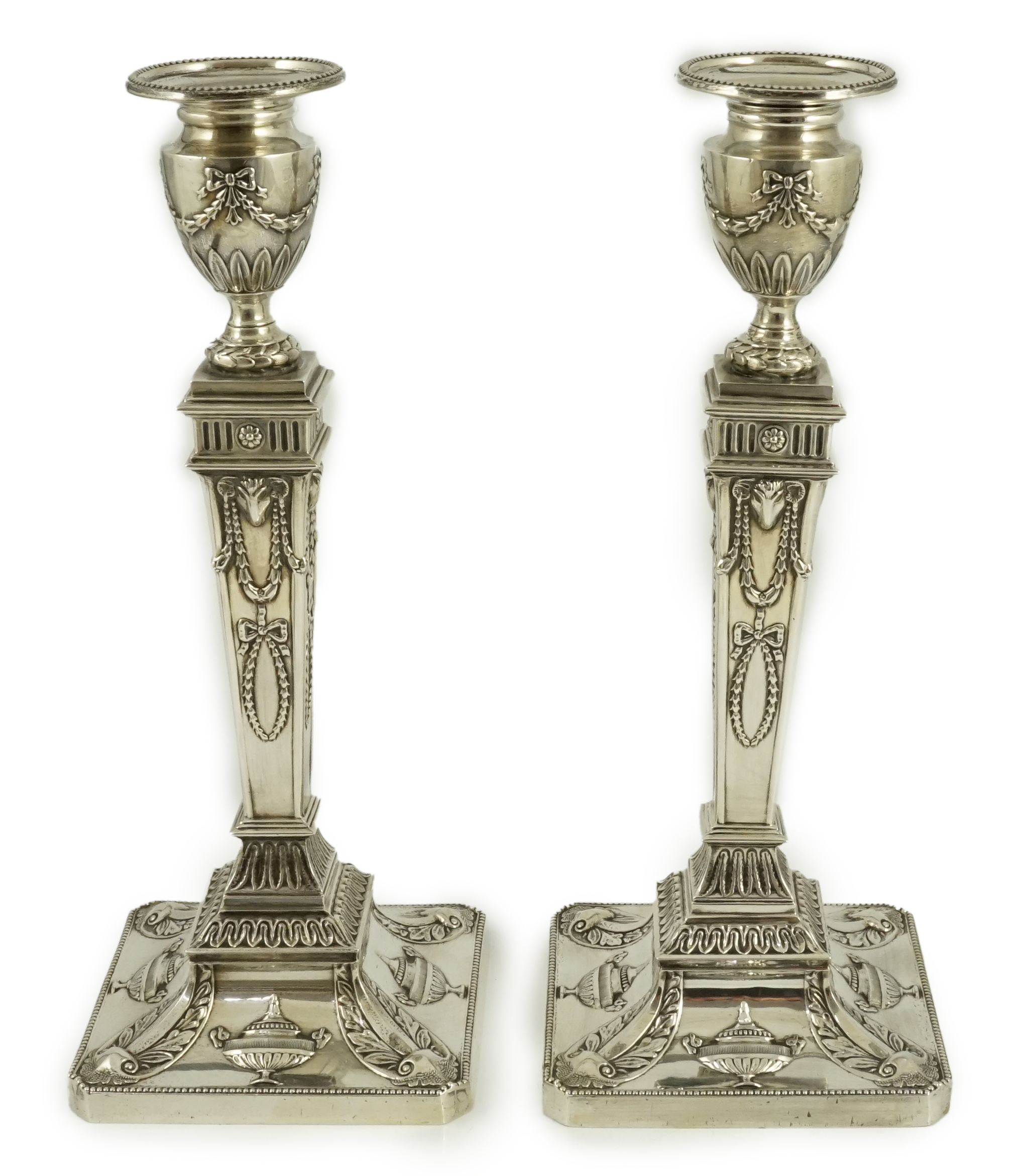 A pair of Elizabeth II Adam style silver candlesticks, by Barker Ellis Silver Co